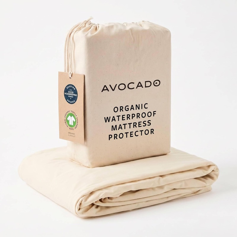 Avocado organic waterproof mattress protector folded under its drawstring storage bag