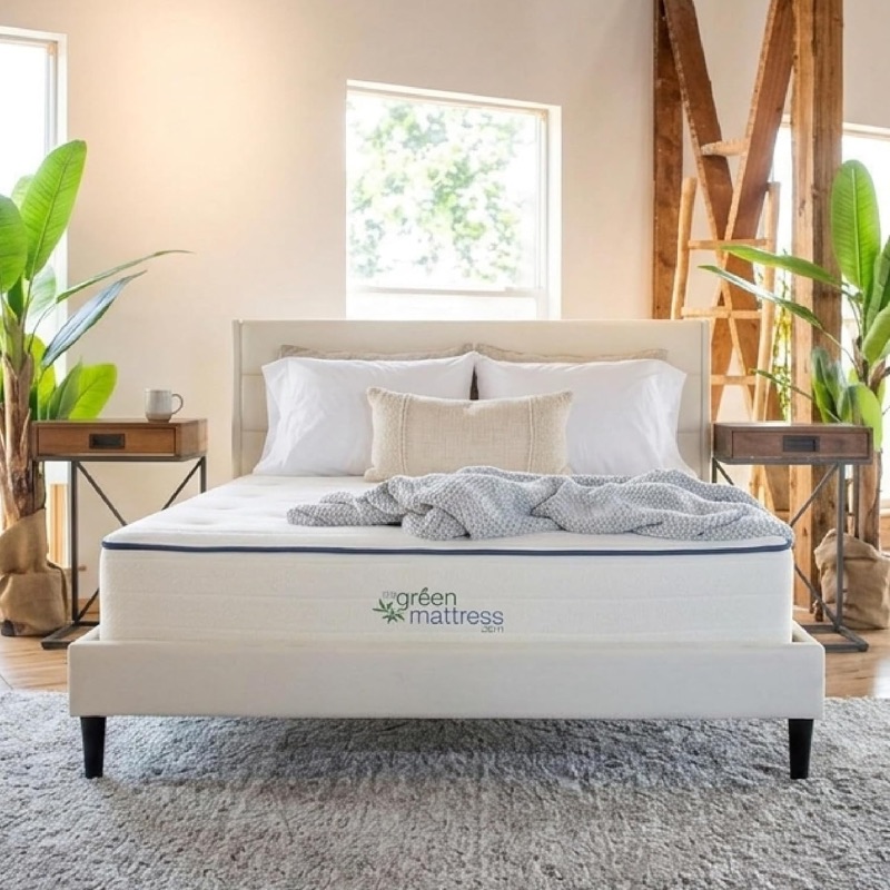 My Green Mattress Kiwi organic mattress on an upholstered bed in a bright room